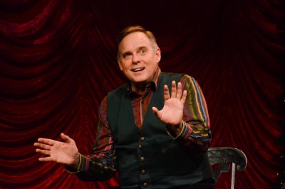 Photo by Emilee Elofson, courtesy of Theatre Latte Da. Tod Petersen on stage, telling a story.