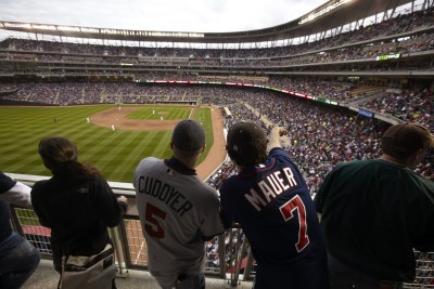 Two friends at target field watching a baseball game